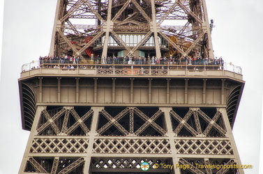 People on the Eiffel Tower as seen from the Quai Branly Museum